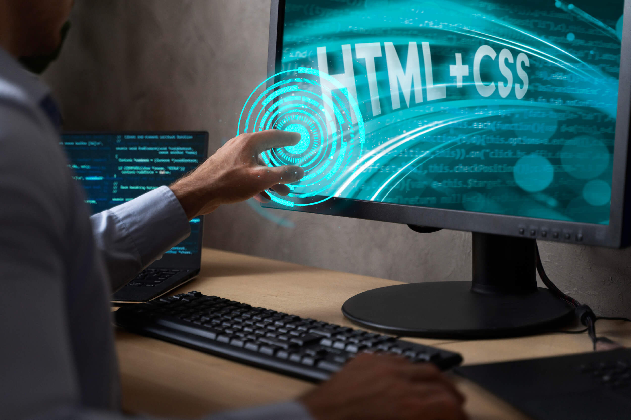 AI in Web Development: A professional interacting with a computer screen displaying HTML and CSS graphics